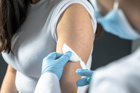 Doctor Administers Virus Protection Vaccineの写真素材