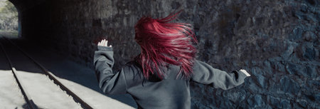The Girl Escapes from Pursuit Through a Tunnel â Thrilling Escapeの写真素材