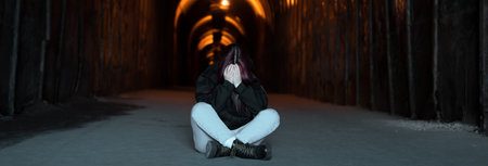 Lonely Girl in the Tunnel â Solitude and Reflectionの写真素材