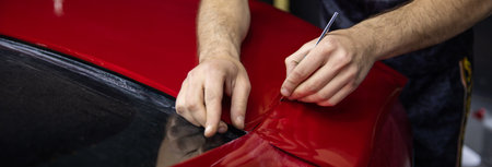 Process of Red Car Vinyl Wrappingの写真素材