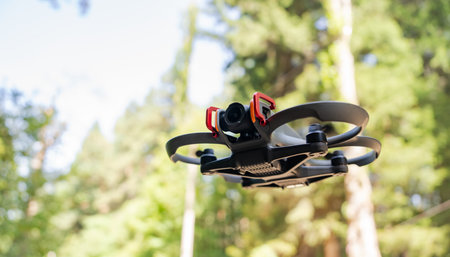 Drone flying above a dense forest, capturing aerial perspectives, exploring natural landscapes, and...