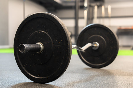 Dumbbells and kettlebells arranged in a modern gym, highlighting strength training equipment used for fitness, bodybuilding, endurance, and functional workout routines.