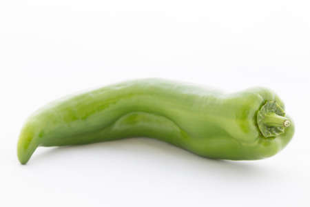 a green pepper on white background