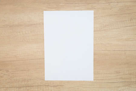 Blank paper sheets for brochure on wooden background. Mock up.