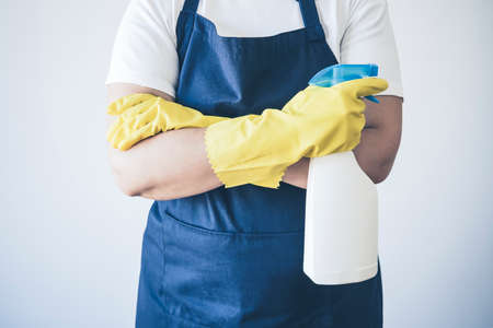 Close-Up Of A woman cleaner With Cleaning and Disinfecting Equipments. Cleaning and disinfection concepts.の写真素材