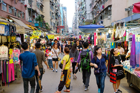 Hong Kong - May 03 2017: Many street vendors selling products on Fa Yuen Street between the buildings. People walk in the busy district of Mong Kok, Kowloon, Hong Kong.のeditorial素材