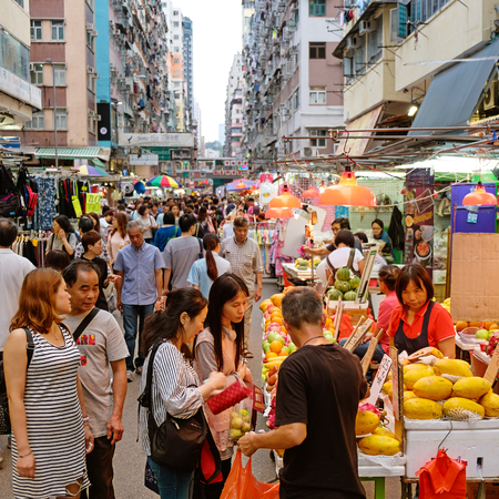 Kowloon, Hong Kong - May 03 2017: Many street vendors selling products on Fa Yuen Street between the buildings. People walk in the busy district of Mong Kok, Kowloon, Hong Kong.のeditorial素材