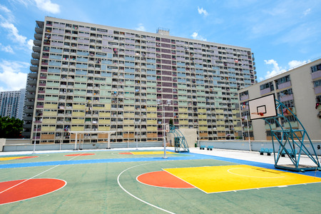 Basketball stand with Old public housing in Hong Kongのeditorial素材