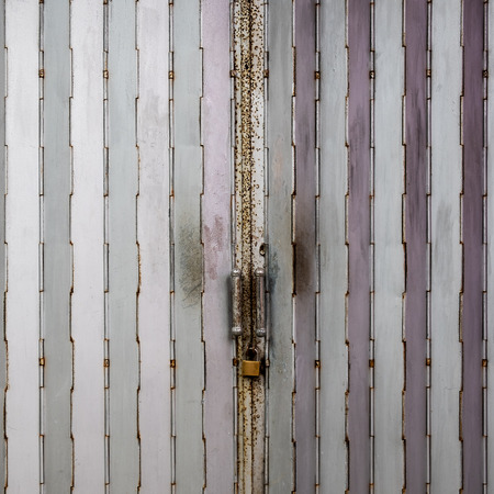 Close up Silver metal shutter door backgroundの写真素材