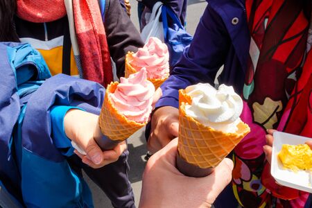 Four soft serve ice cream cone with premium strawberry and milkの写真素材