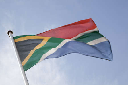 South African Flag against Blue Backgroundの写真素材
