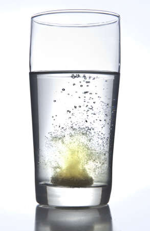 Effervescant tablet in waterの写真素材