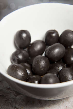 Black calamata olives in a bowlの写真素材