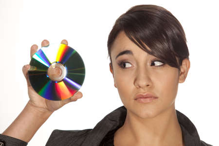Young professional woman with a cd in her hand looking worried