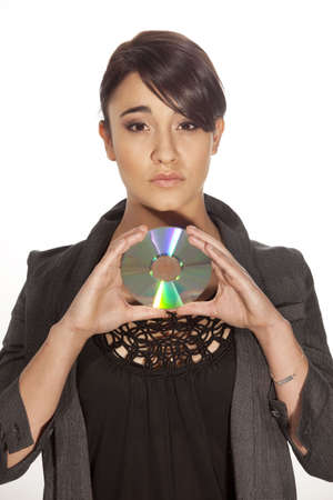 Professional woman holding a Cd infront of her.の写真素材