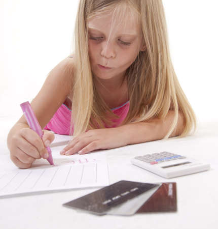 Little girl drawing on a spreadsheet with a crayon, surrounded by financial parephernalia. 