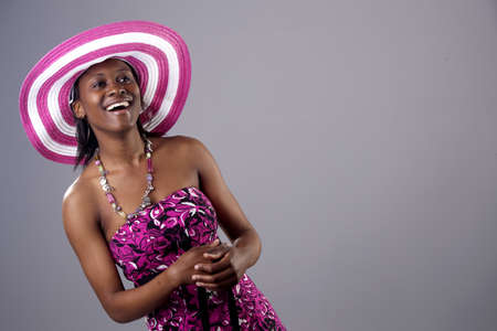 Beautiful young South African woman in bright coloursの写真素材