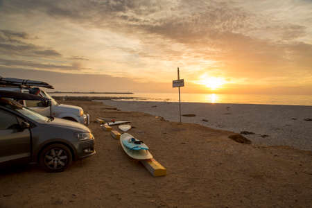 Surfboards and cars at the beach, after a good day's surf on South Africa's West Coast, at Lambert's Bay, Yo-Yo Bay.の写真素材
