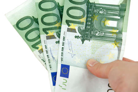 Hand holding euro money. Isolated on white.の写真素材
