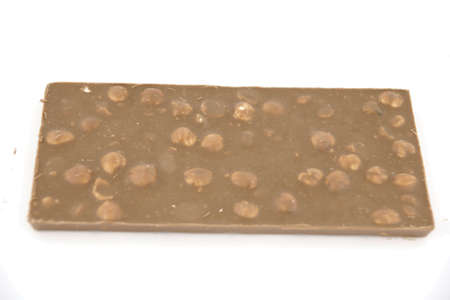 Delicious milk chocolate with hazelnuts の写真素材