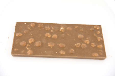 Delicious milk chocolate with hazelnuts の写真素材