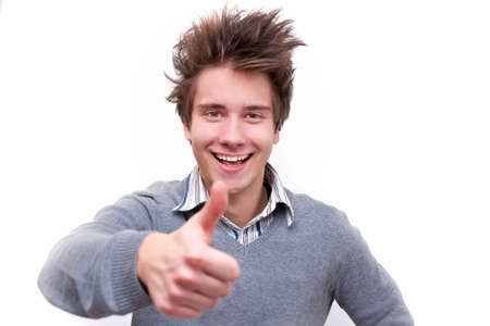 Happy young guy showing thumbs up sign  