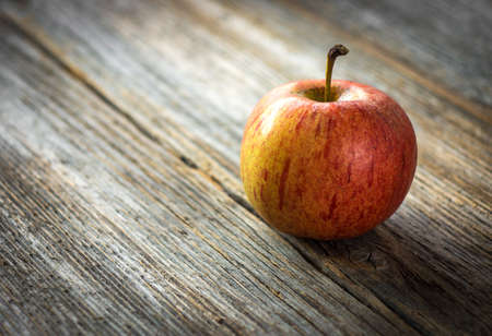Apple on wooden backgroundの写真素材