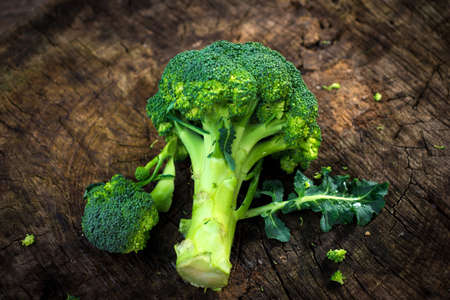 Fresh green broccoli on wooden backgroundの写真素材