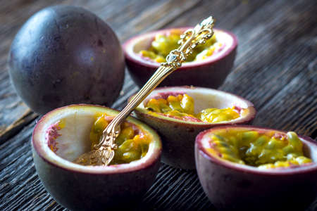 Passion fruits on wooden backgroundの写真素材