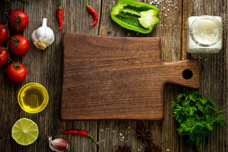 Vegetables on wooden background with empty copy space.の写真素材