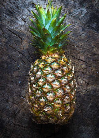Pineapple on wooden background