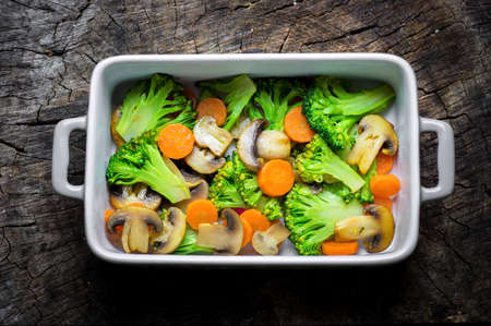 Grilled vegetables with olive oil on wooden backgroundの写真素材