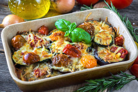 Eggplant,zucchini and tomato with mozzarella in Casseroleの写真素材