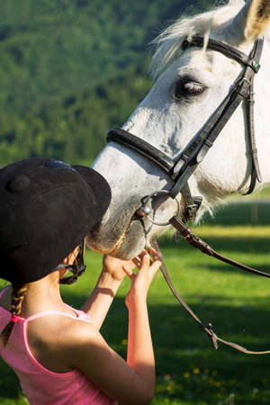 Horse and lovely girl - best friendsの写真素材