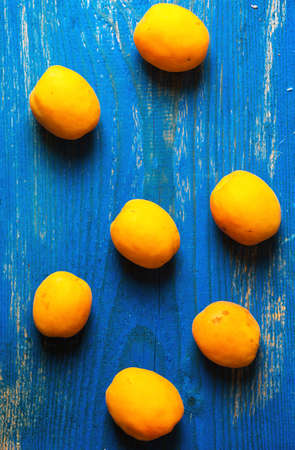 Apricot  on old wooden backgroundの写真素材