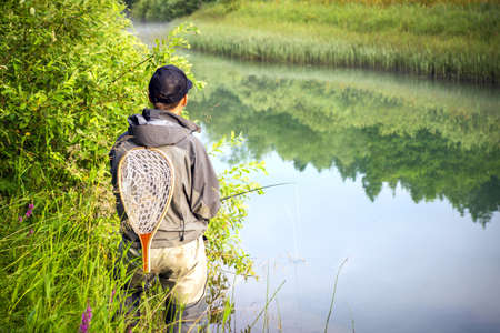 Closeup of fisherman fly fishing