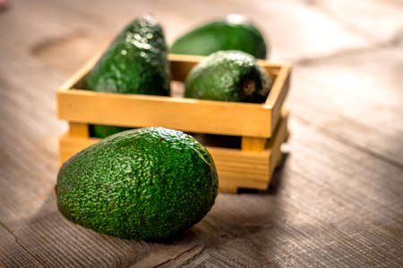 Avocado on  wooden backgroundの写真素材