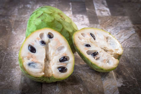 Cherimoyas on stone backgroundの写真素材