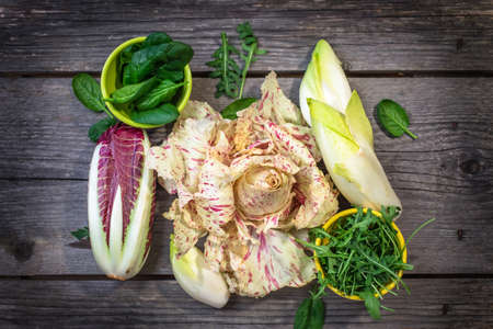 Fresh colorful  lettuce on wooden backgroundの写真素材