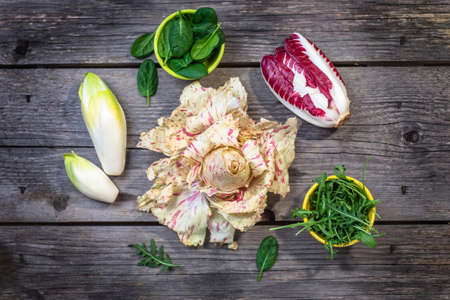 Fresh colorful  lettuce on wooden background