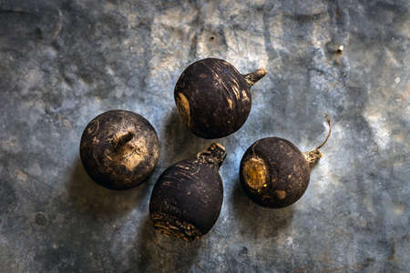 Black Radish on rustic backgroundの写真素材