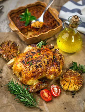 Roasted whole chicken on backing paperの写真素材