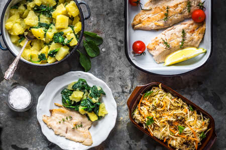 Griled fish fillet with potato and saladの写真素材