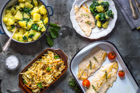 Griled fish fillet with potato and saladの写真素材