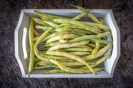 Fresh beans on wooden backgroundの写真素材