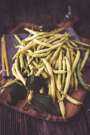 Fresh beans on wooden background
