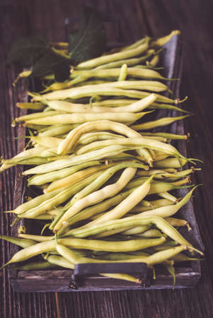 Fresh beans on wooden backgroundの写真素材
