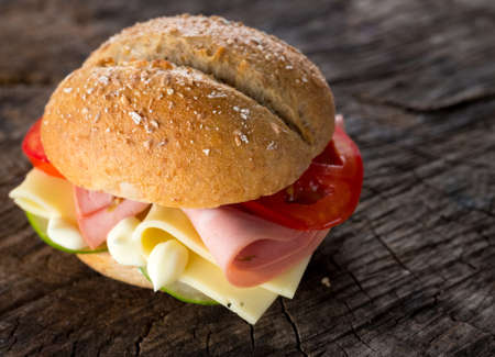 Sandwich with mortadella, cheese and vegetablesの写真素材