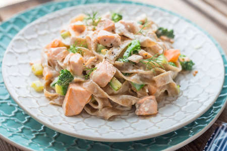 Pasta with salmon in a creamy sauceの写真素材