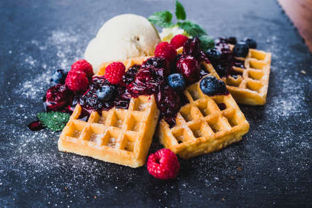 Waffles with icecream and berriesの写真素材